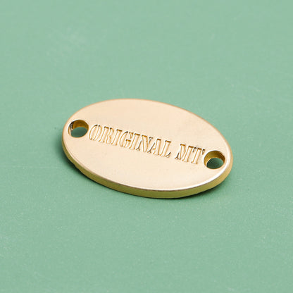 Polished gold custom oval metal label with mounting holes