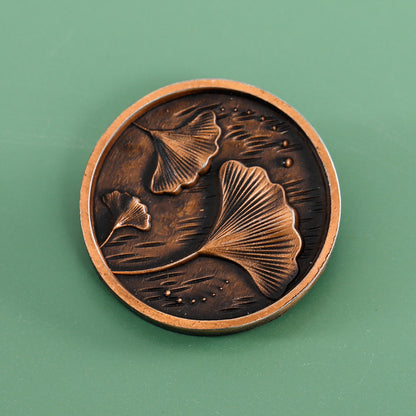 Antique copper custom zinc alloy label with embossed botanical relief