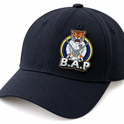Custom hard enamel logo pin displayed on a baseball cap